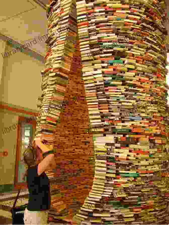 A Book Sculpture Of A Human Figure Made From Stacked And Folded Books Art Made From Books: Altered Sculpted Carved Transformed