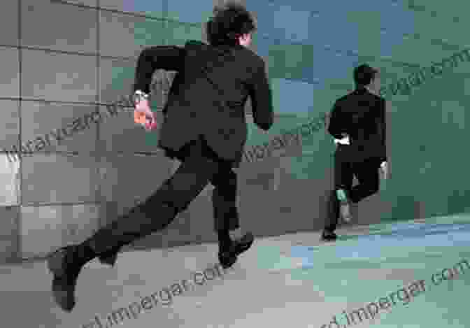 A Man In A Suit Chasing Another Man In A Dark Alley, Symbolizing The Relentless Pursuit Of The Dangerous Spy Trinity: The Treachery And Pursuit Of The Most Dangerous Spy In History